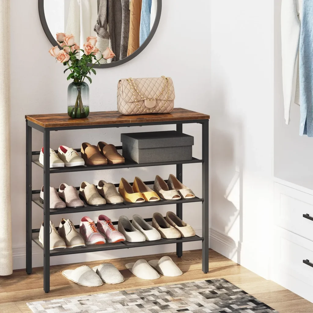 Modern rustic entryway shoe rack standing next to a round wall mirror, featuring organized footwear, house slippers on the floor, and stylish decorative accents in a bright foyer.