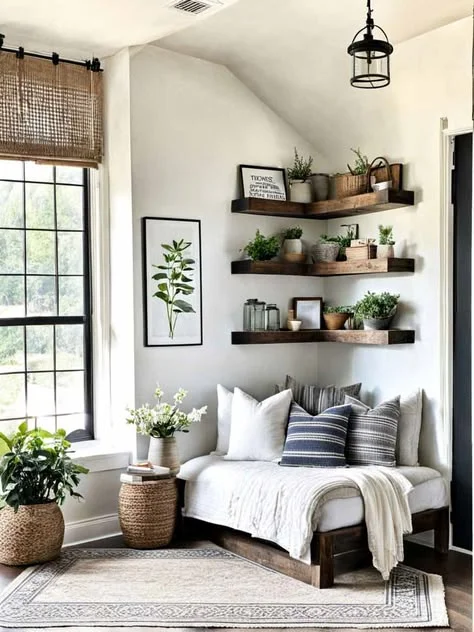 rustic living room corner reading nook with floating shelves A cozy living room corner reading nook featuring a low wooden daybed with white and blue striped throw pillows, nestled under three rustic wooden L-shaped floating shelves filled with potted plants and small decor pieces.