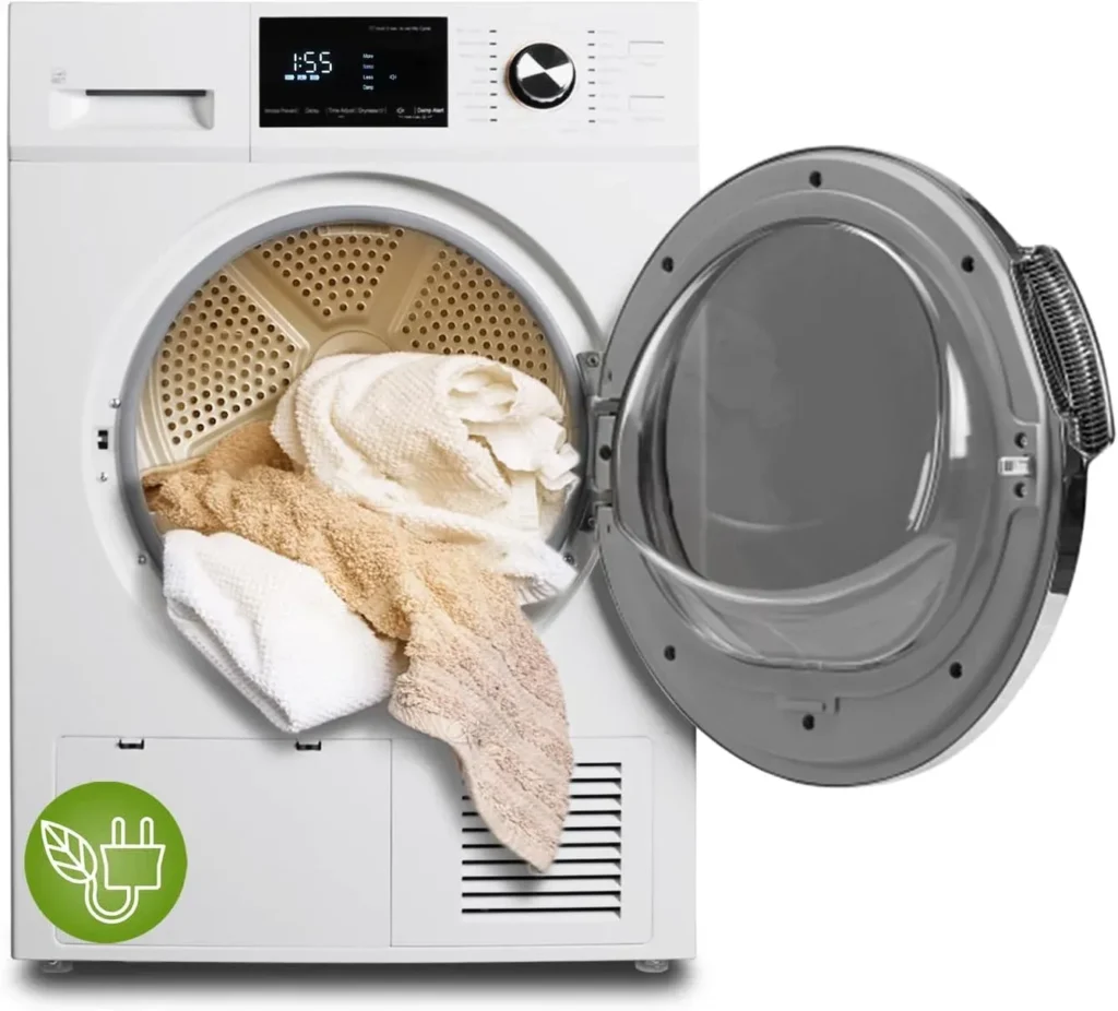 A modern white front-loading clothes dryer with an open glass door, showing freshly laundered white and beige towels inside the stainless steel drum, featuring a digital display panel and a green eco-friendly energy-saving leaf plug icon in the bottom corner.