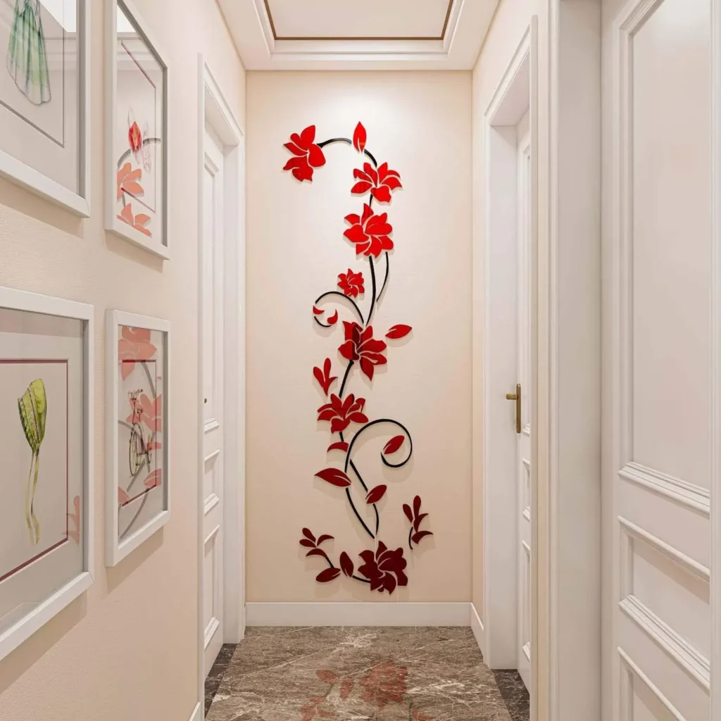 Vertical red 3D acrylic floral vine wall sticker mounted on a cream-colored hallway accent wall between doorway entrances.